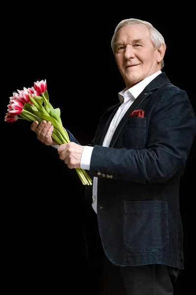 Senior man with tulips — Stock Photo, Image