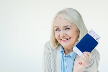 senior woman with passports and tickets clipart