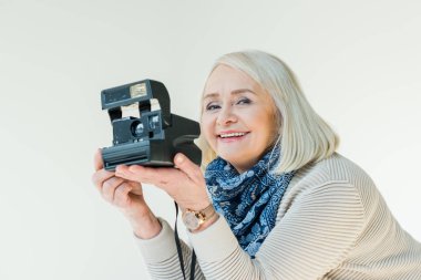 senior woman with retro camera clipart