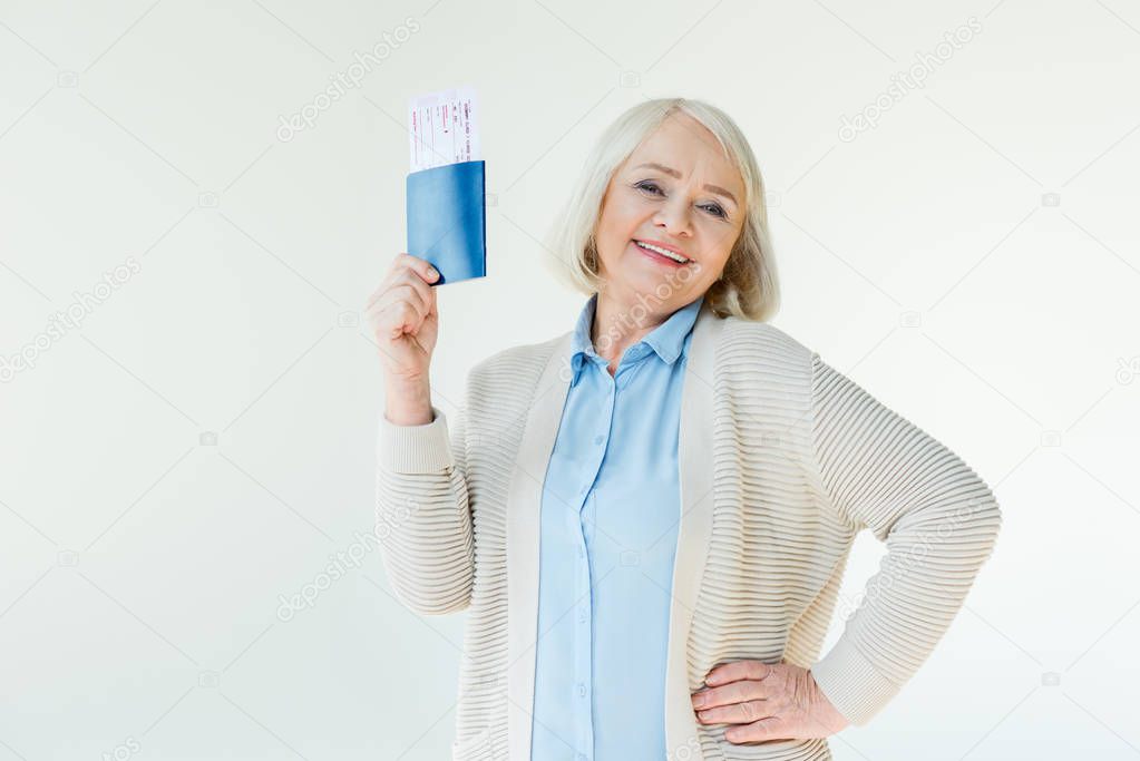 senior woman with passports and tickets