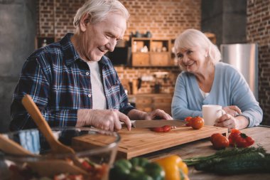 Senior couple in kitchen clipart