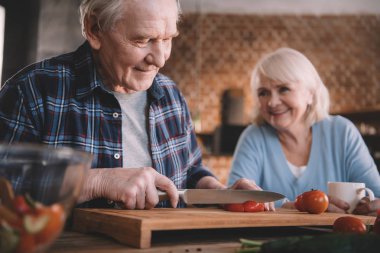 Senior couple in kitchen clipart