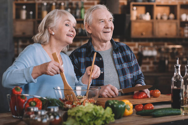 senior couple cooking together