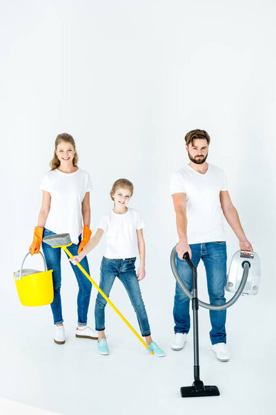 family with cleaning supplies 