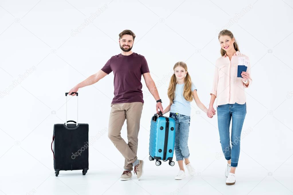 family with traveling bags