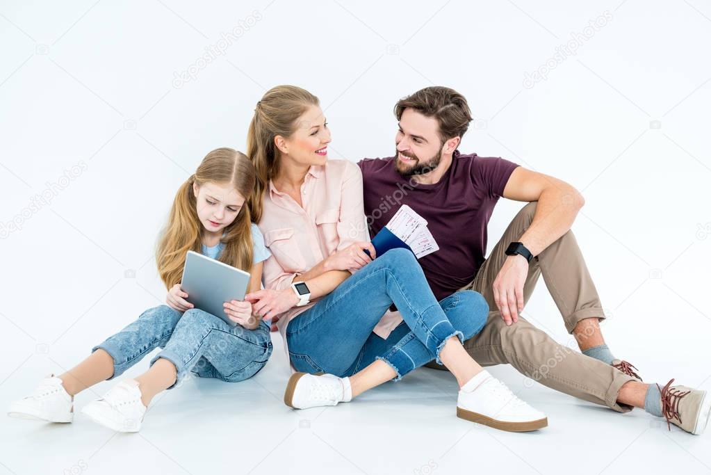 family with passports and tickets