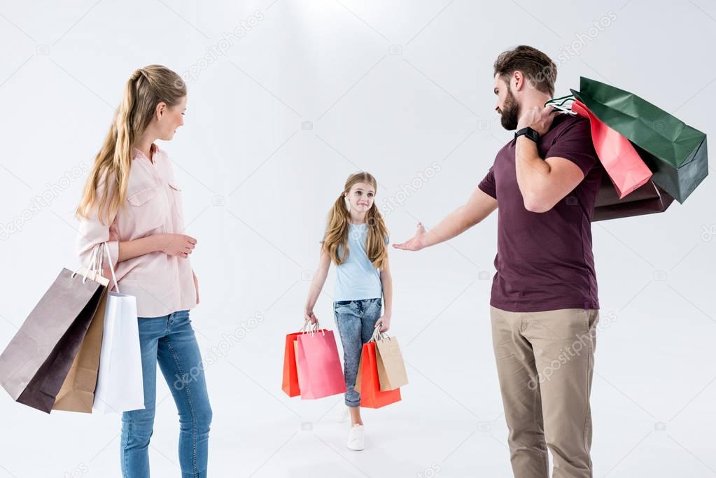 family with shopping bags  