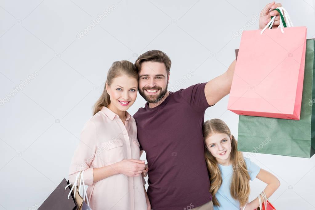 family with shopping bags  