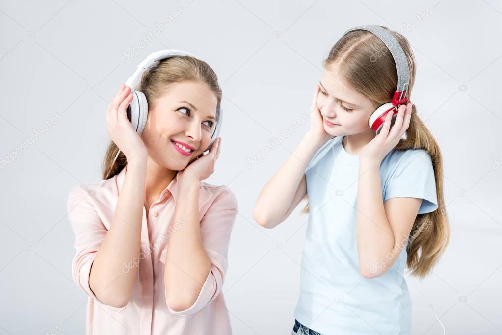 mother and daughter with headphones