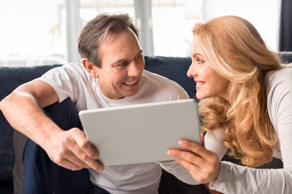 couple using digital tablet 