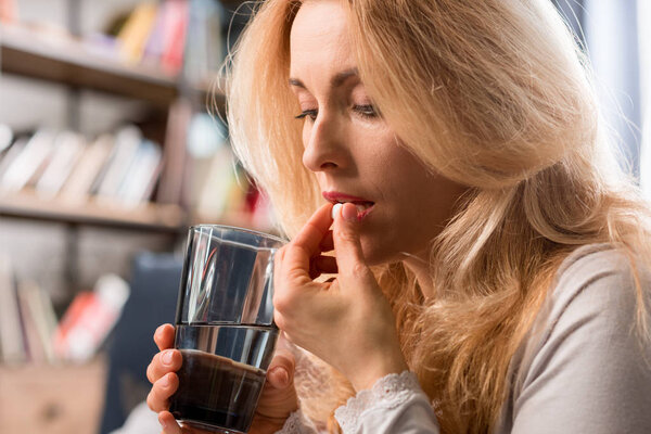 Woman taking pill 