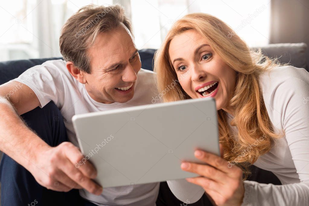 couple using digital tablet 