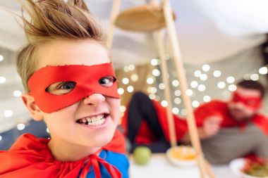 Boy in superhero costume  clipart