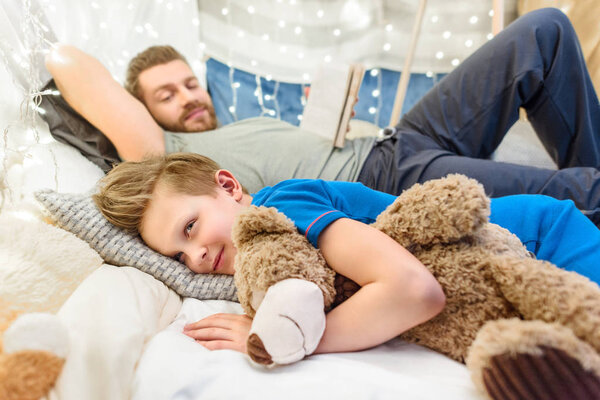 Father and son in blanket fort 