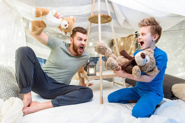 Father and son in blanket fort 