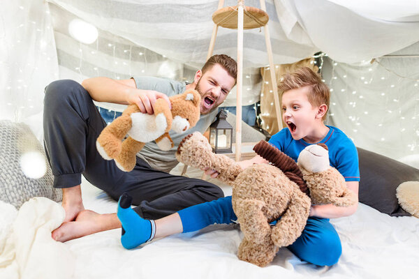 Father and son in blanket fort 