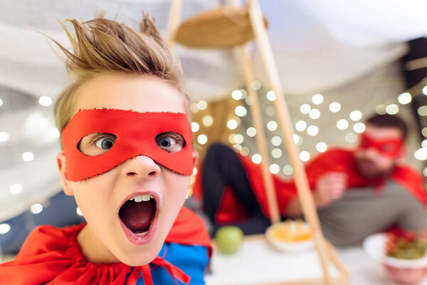 Boy in superhero costume 
