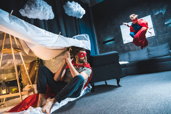 father and son playing