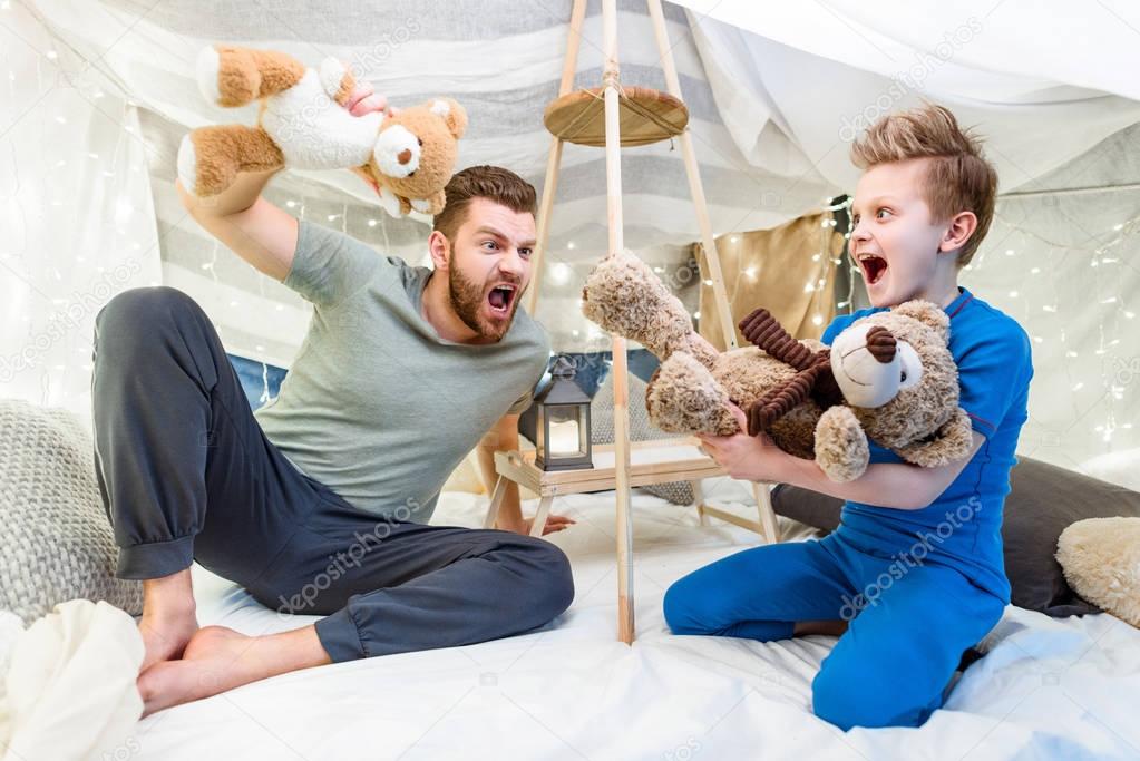 Father and son in blanket fort 