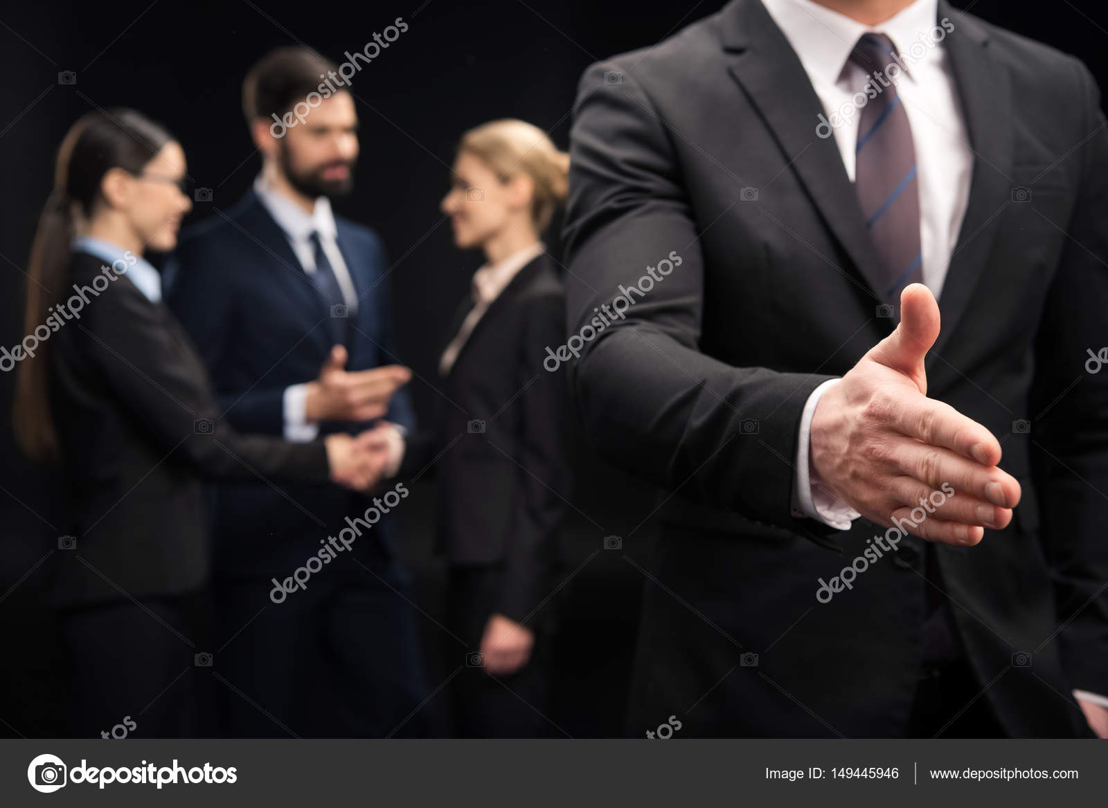 Businessman showing handshake sign Stock Photo by ©TarasMalyarevich