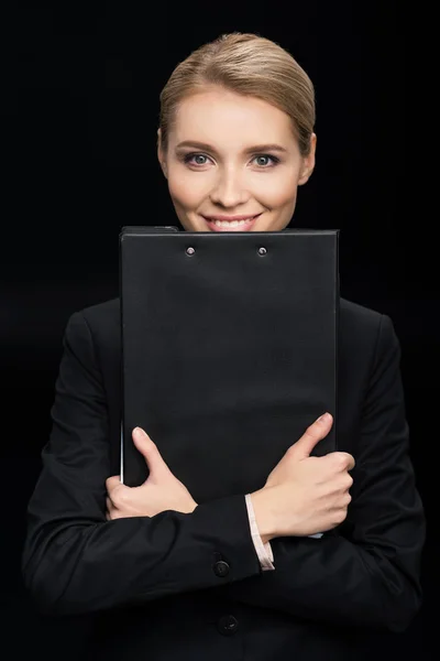 Mulher de negócios com o bloco de notas em mãos — Fotografia de Stock