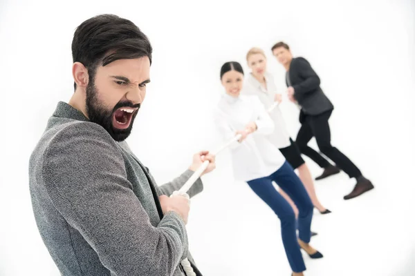 Business people pulling over rope — Stock Photo, Image