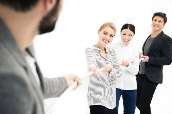 Business people pulling over rope — Stock Photo, Image