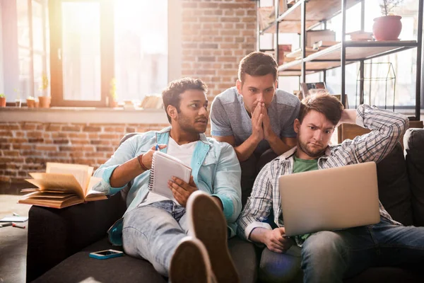 Young professionals working with laptop — Stock Photo, Image