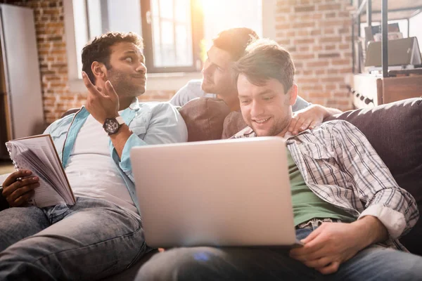 Young professionals working with laptop — Stock Photo, Image