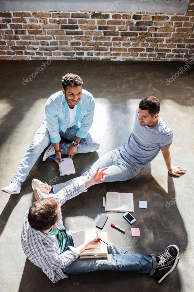 Overhead view of small office meeting in small business office