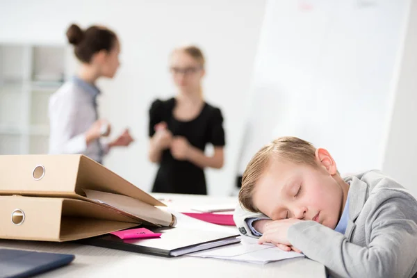 Little boy dreaming on table — Stock Photo, Image