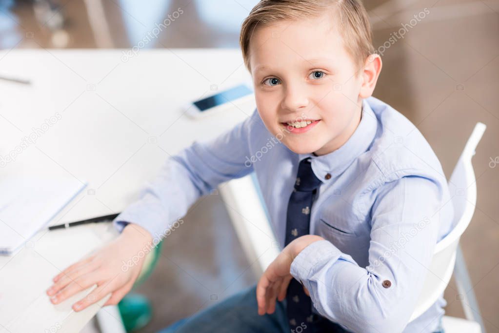 Smiling boy in formal clothes