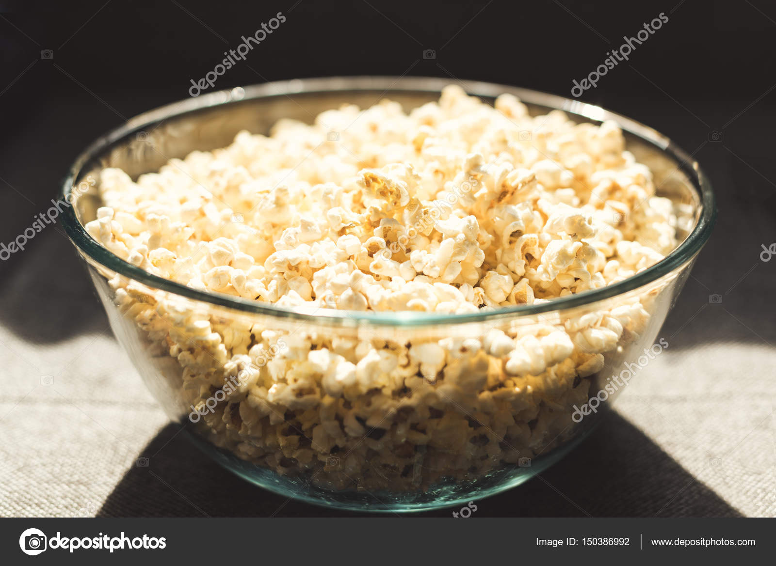 Popcorn in glass bowl — Stock Photo © TarasMalyarevich 150386992