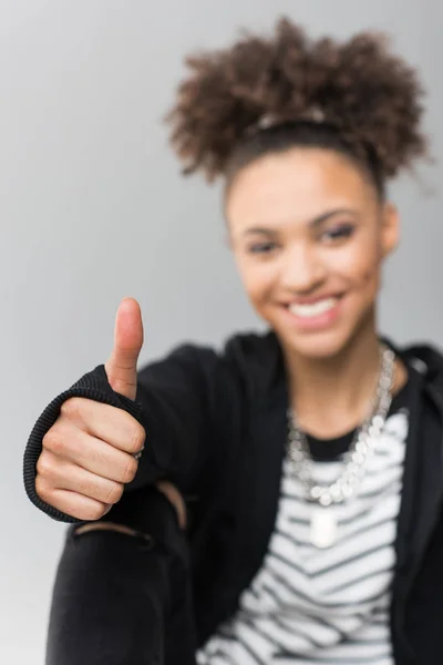 Girl showing thumb up — Free Stock Photo