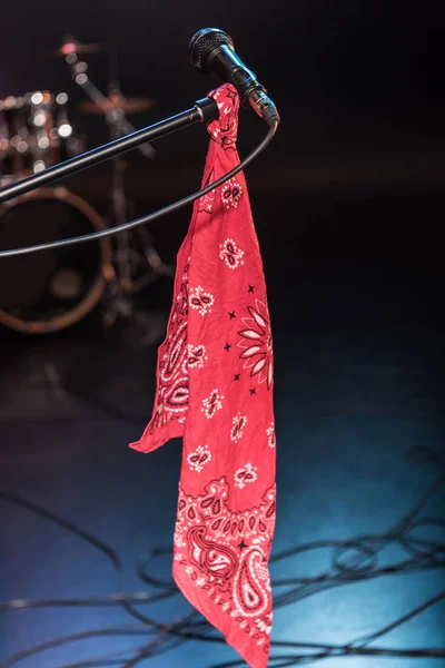 Microphone with scarf on stage — Stock Photo, Image