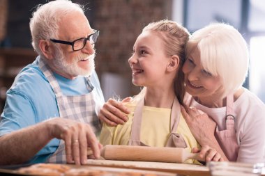 family kneading dough  clipart