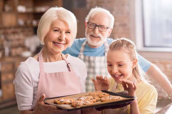 girl looking at homemade cookies