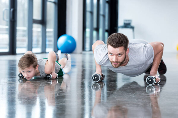 Man and boy doing push ups 