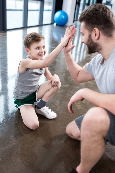 Boy giving high five