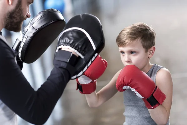 Boy boxer practicing punches — Stock Photo, Image