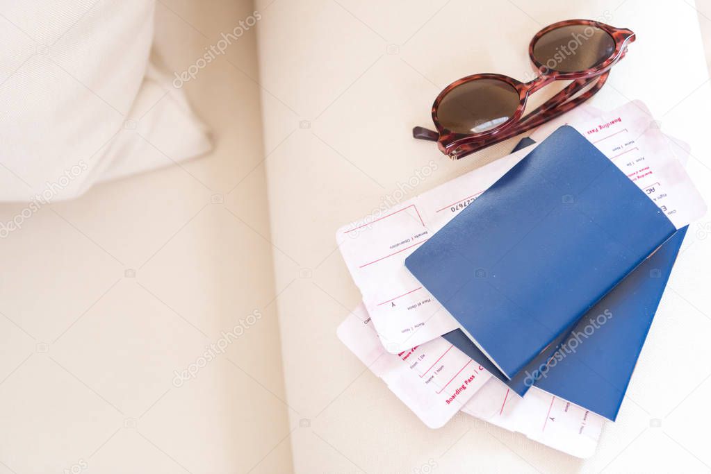 Passports with tickets and sunglasses 
