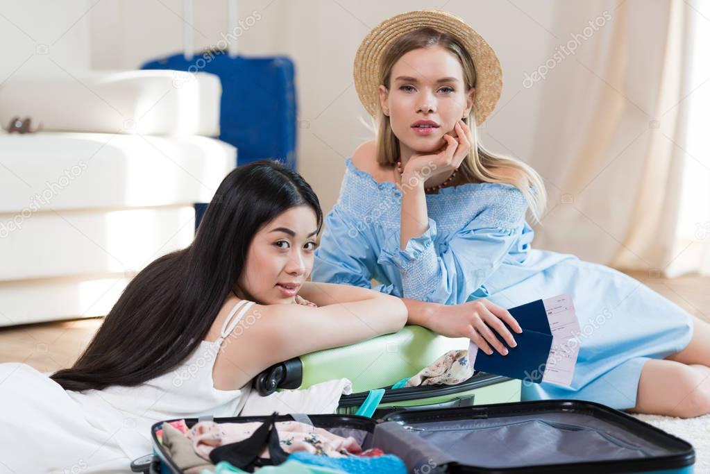 Women packing suitcases 