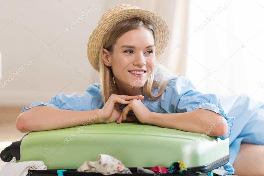 Woman packing suitcase 