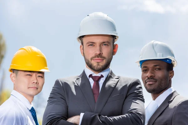 Professional architects in hard hats — Stock Photo, Image