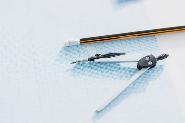 Compasses and pencil on empty blueprint — Stock Photo, Image