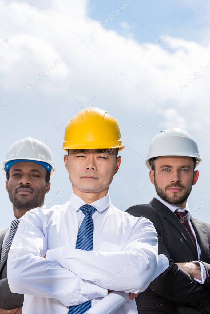 professional architects in hard hats