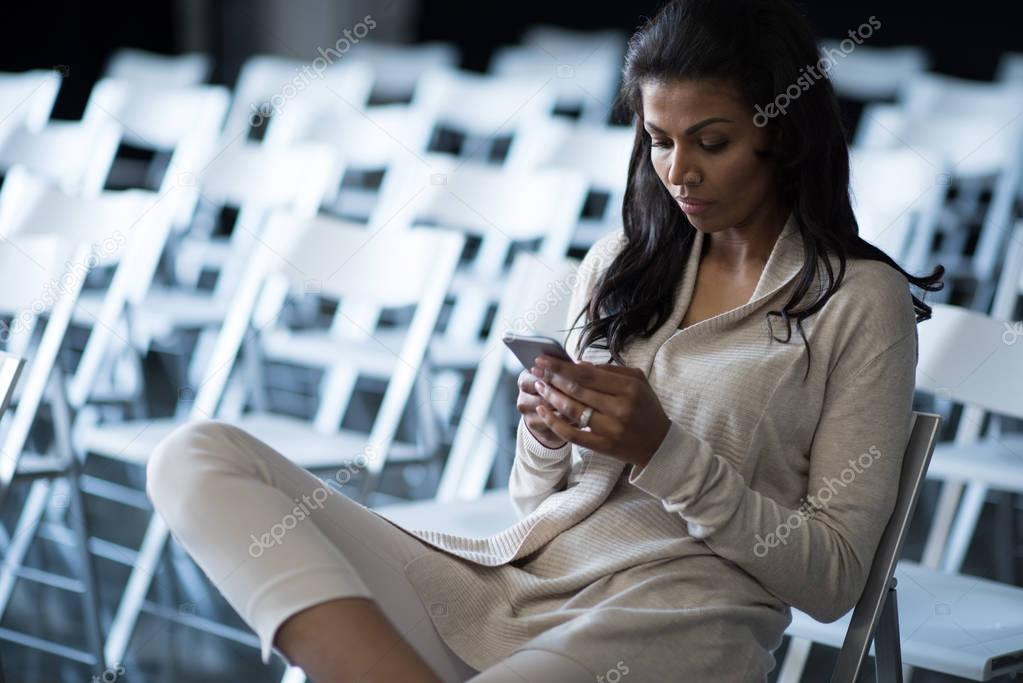 african american woman using smartphone