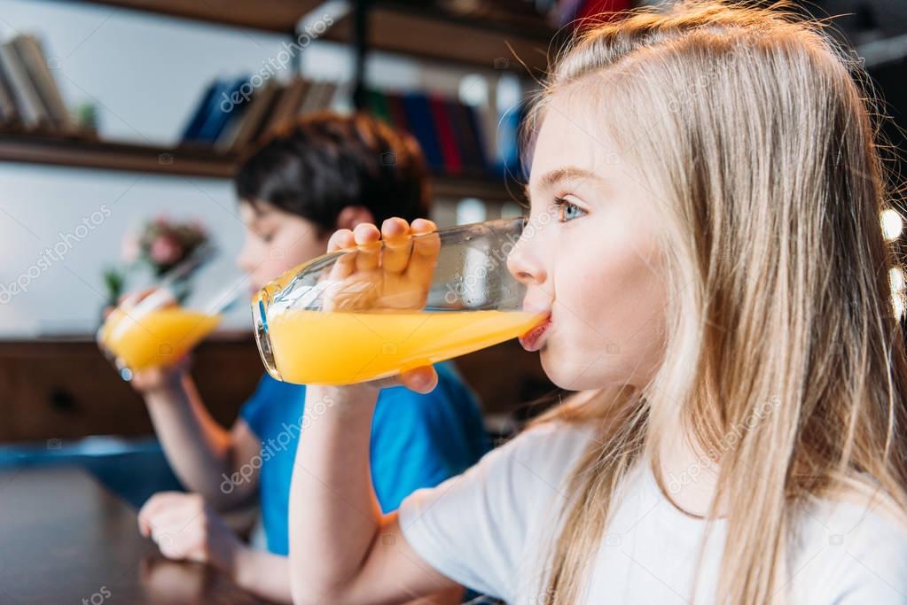 Download Girl drinking orange juice — Stock Photo © TarasMalyarevich #153730804