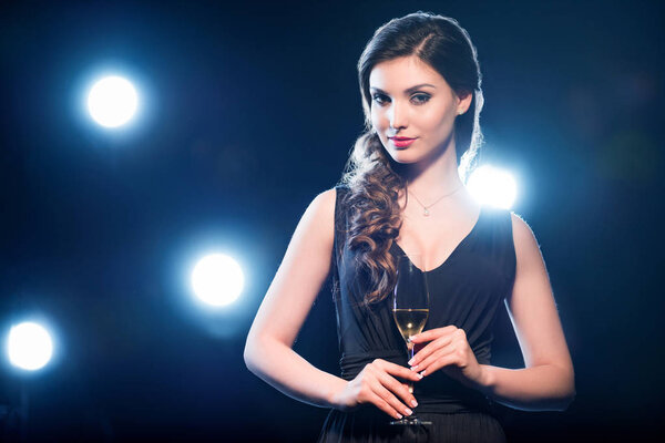 Stylish woman drinking champagne 