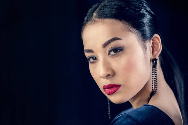 asian woman looking at camera